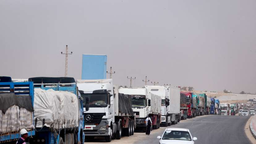 FILE PHOTO: Trucks stand at the Rafah border crossing between Egypt and the Gaza Strip