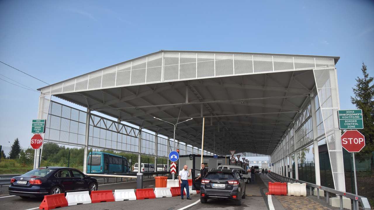 People are seen at the renovated Ukraine-Poland border crossing point near the village of Krakovets