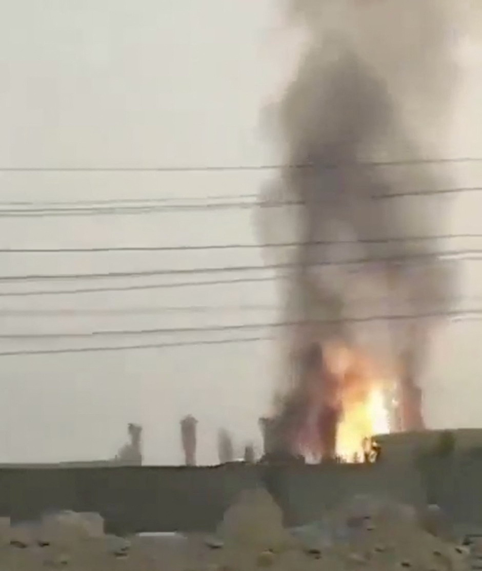 A fire burns at South Pars gas field, in Tonbak
