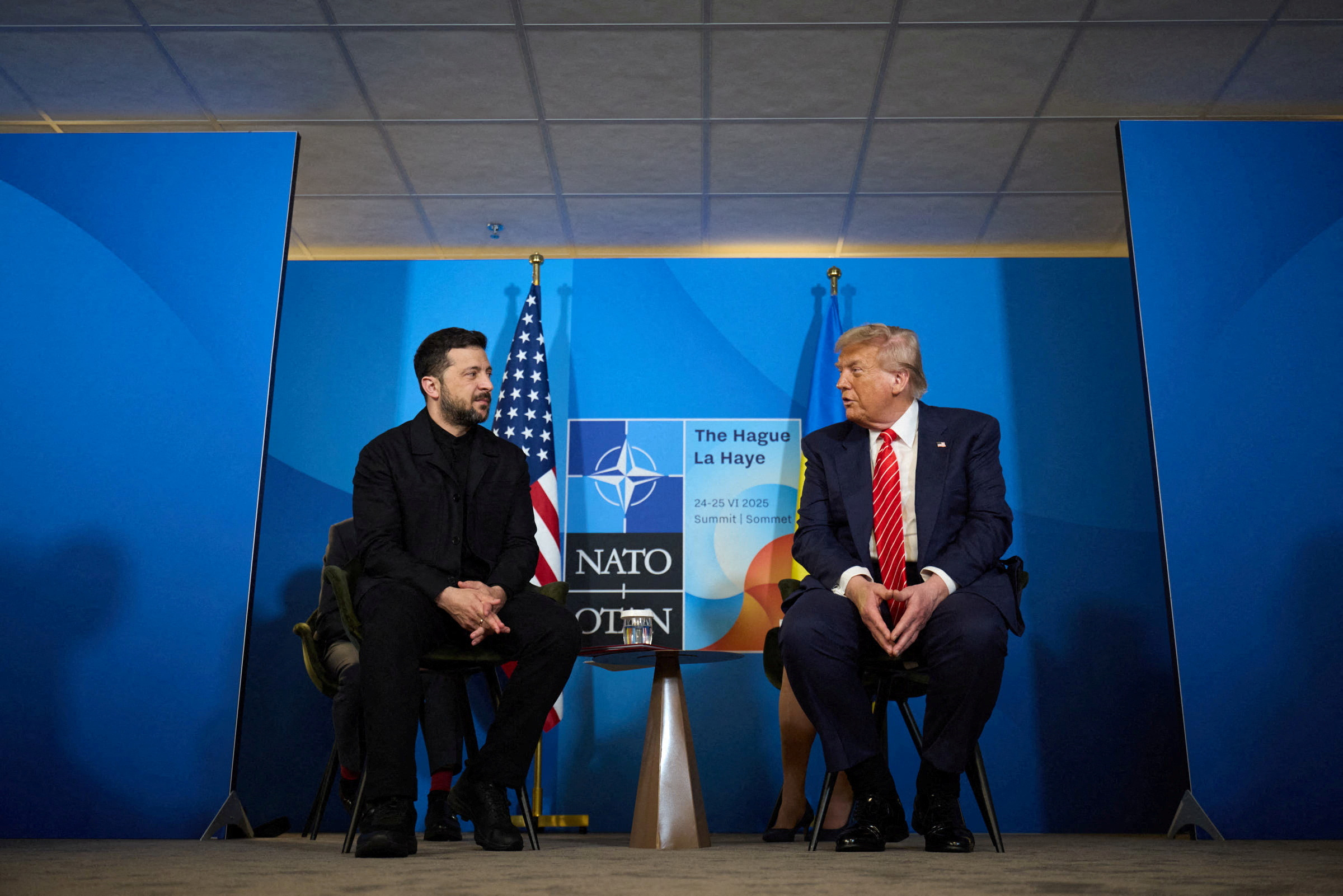FILE PHOTO: U.S. President Trump and Ukraine's President Zelenskiy attend a meeting on the sidelines of NATO summit in The Hague