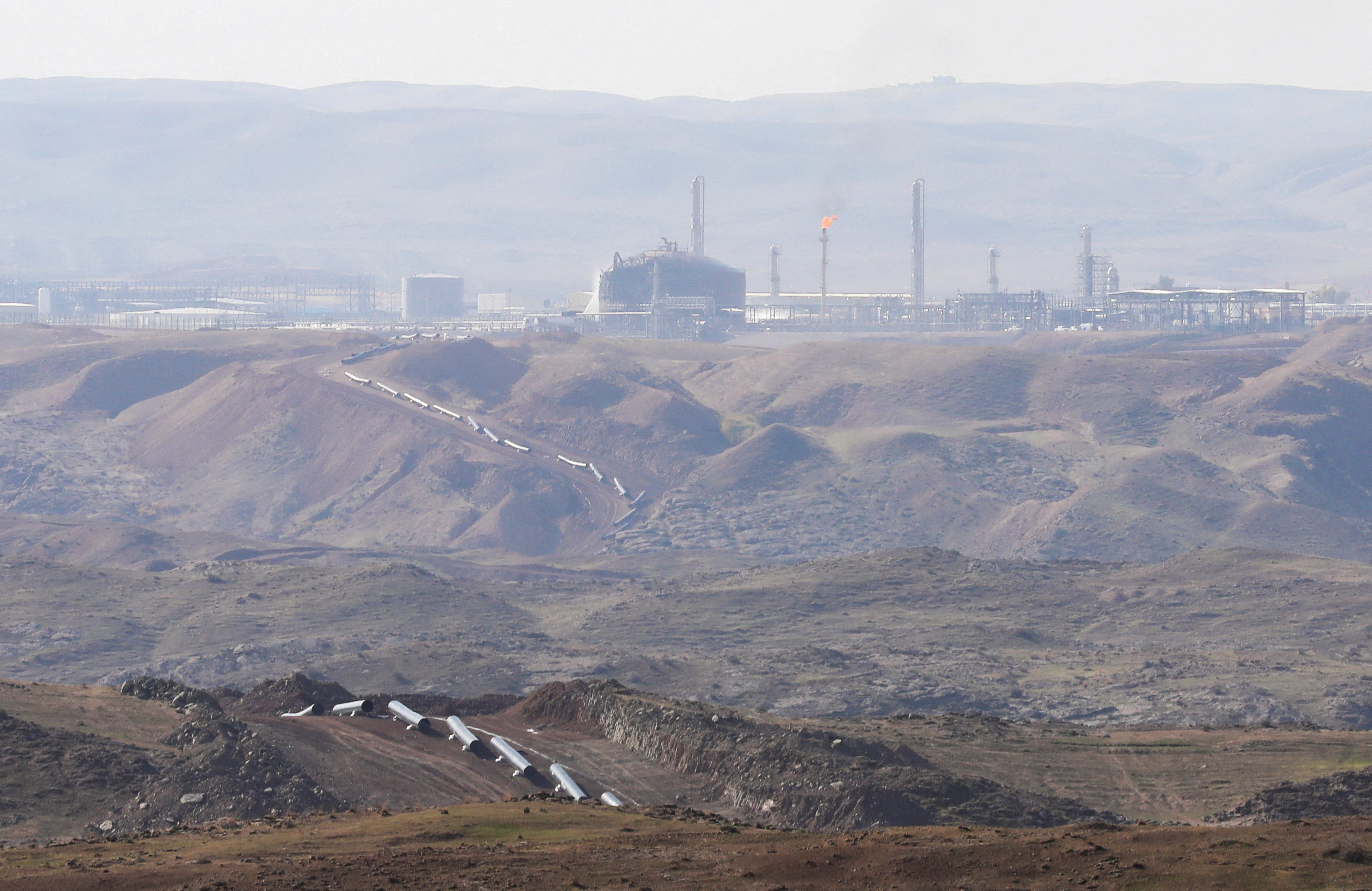 FILE PHOTO: The Khor Mor gas field after a rocket attack near Chamchamal, in Sulaymaniyah province, Iraq