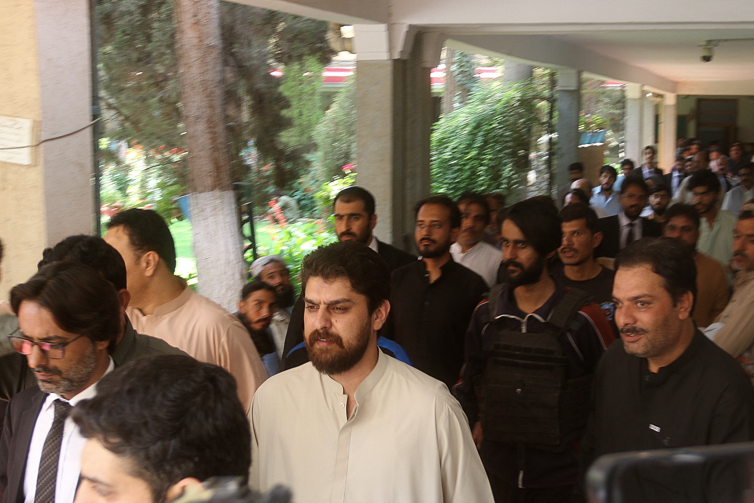 Policemen escort tribal chief Sher Baz Satakzai, in Quetta