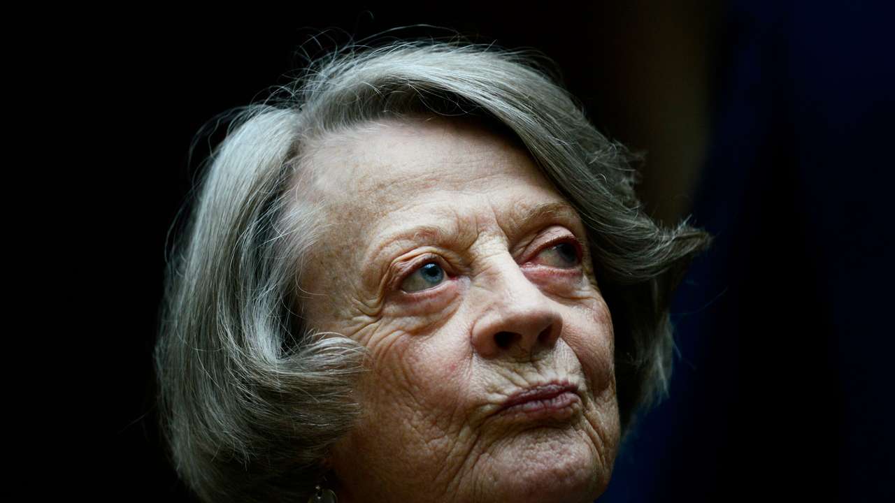 Downton Abbey cast member Maggie Smith poses for the media at a hotel in London