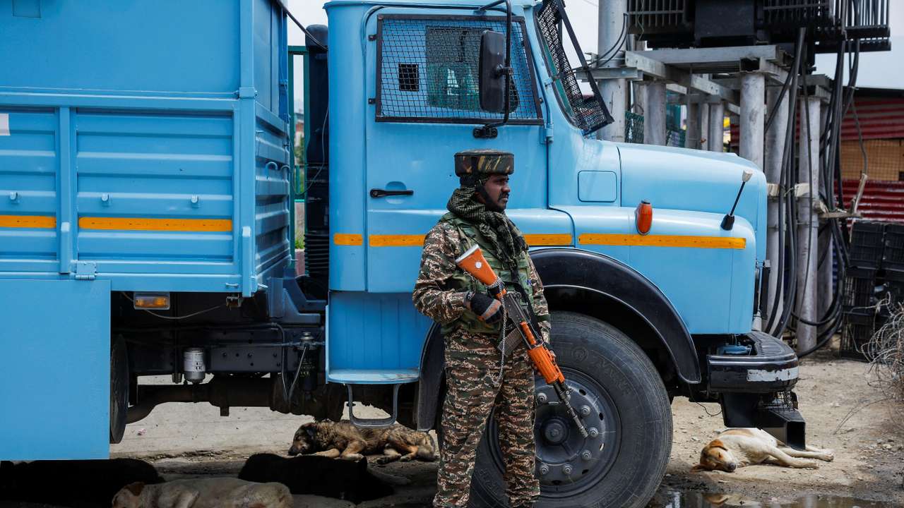 An Indian security force personnel stands guard on a street, following a suspected militant attack near south Kashmir's Pahalgam, in Srinagar