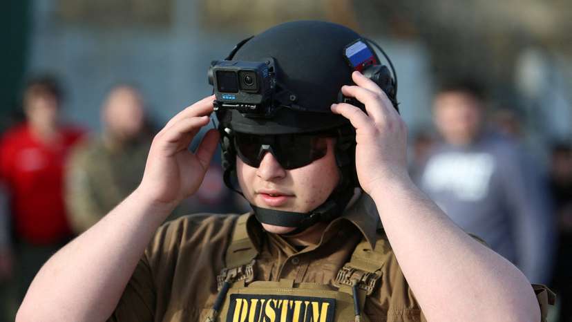 FILE PHOTO: Adam Kadyrov, son of Chechen leader Ramzan Kadyrov and head of his security department, takes part in a tactical shooting competition in Gudermes