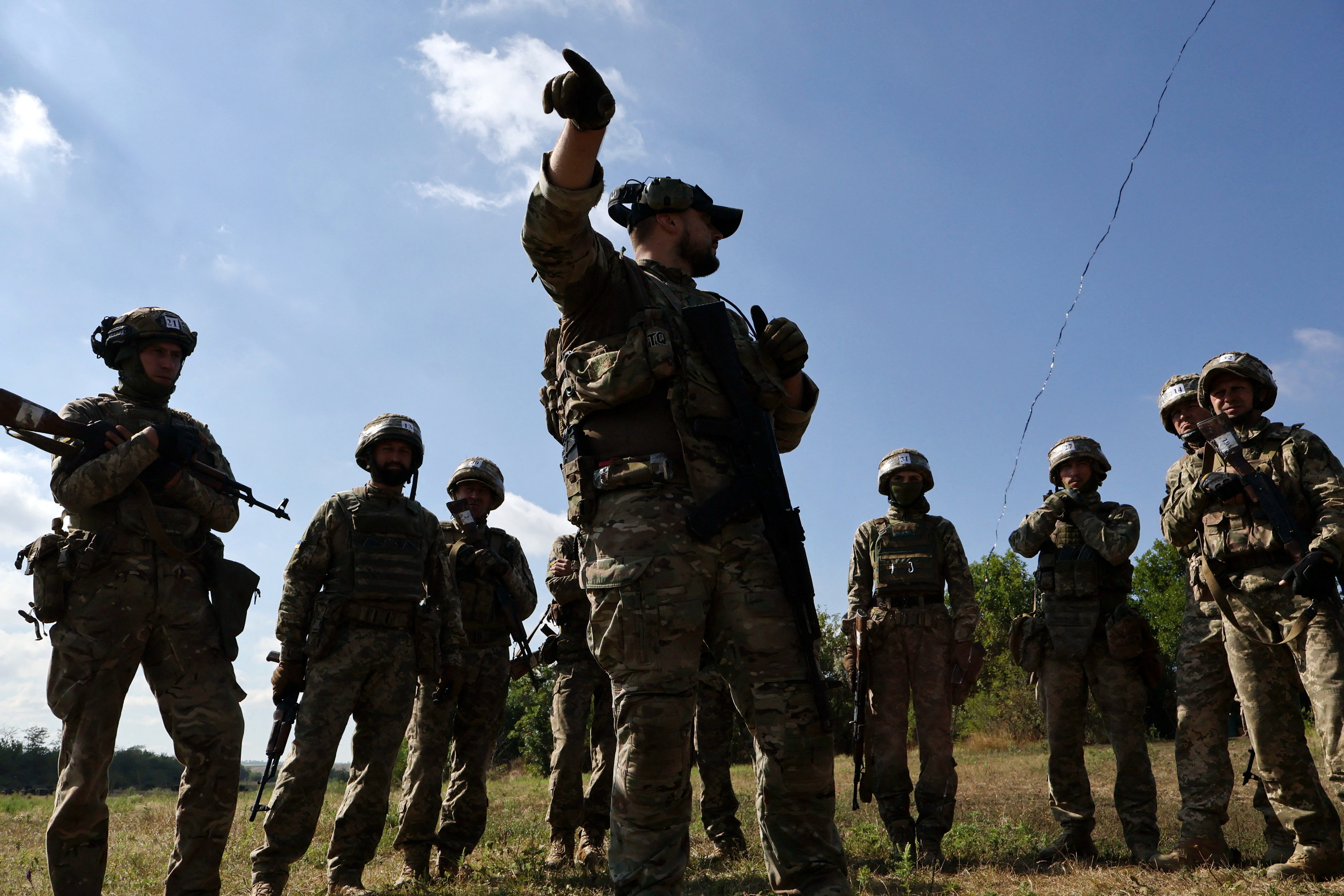 Ukrainian service members attend a military drill near a frontline, in Zaporizhzhia region