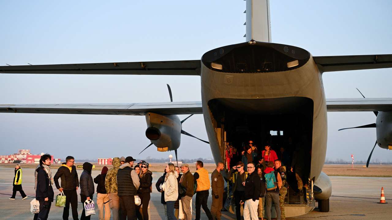 Repatriated Slovaks who were stranded in Jordan amid the U.S.-Israel conflict with Iran, arrive at M. R. Stefanik Airport, in Bratislava