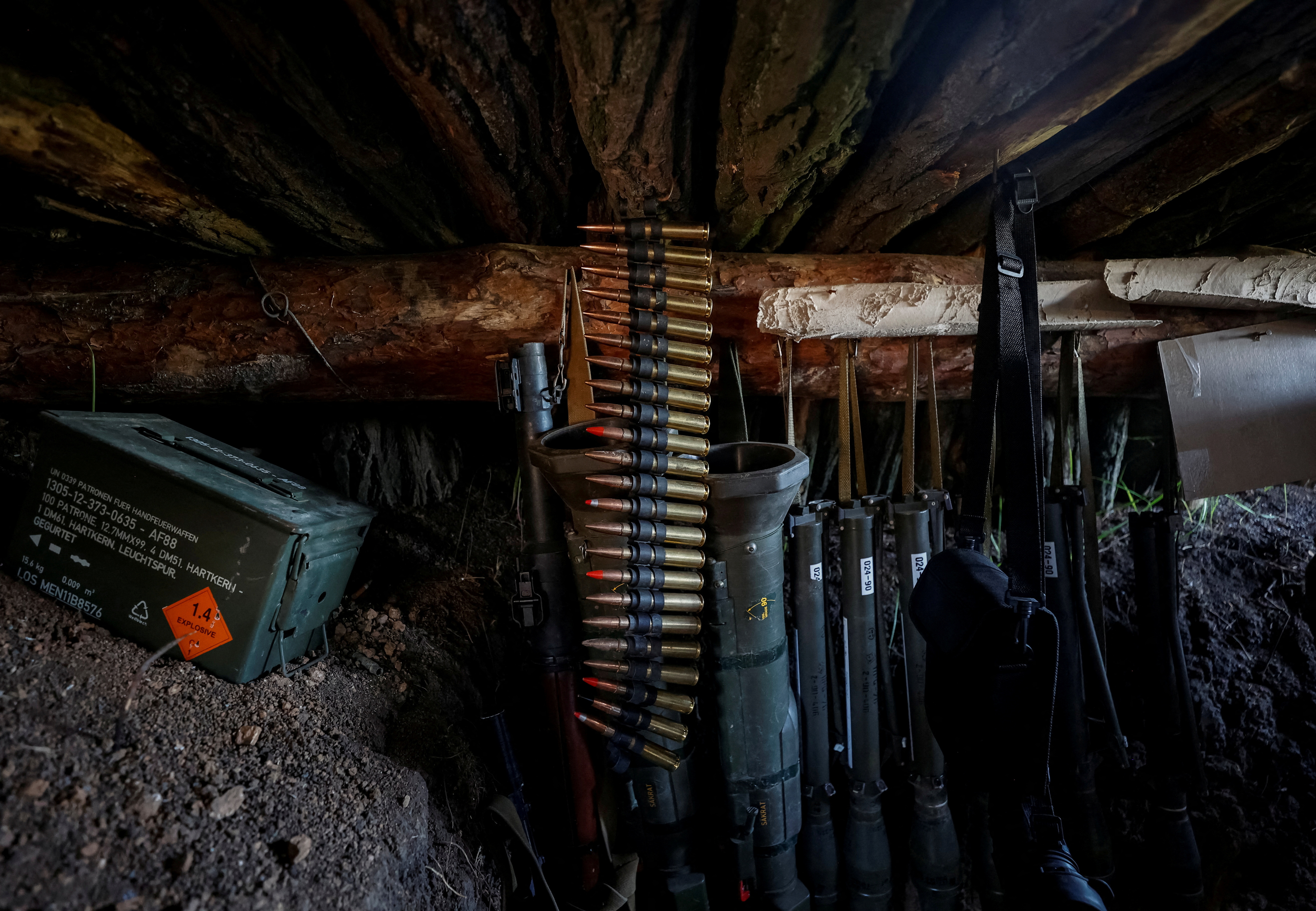 FILE PHOTO: Weapons of Ukrainian service members are seen in a trench at position at a front line in Donetsk region
