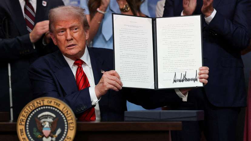 FILE PHOTO: U.S. President Donald Trump signs an executive order, in Washington