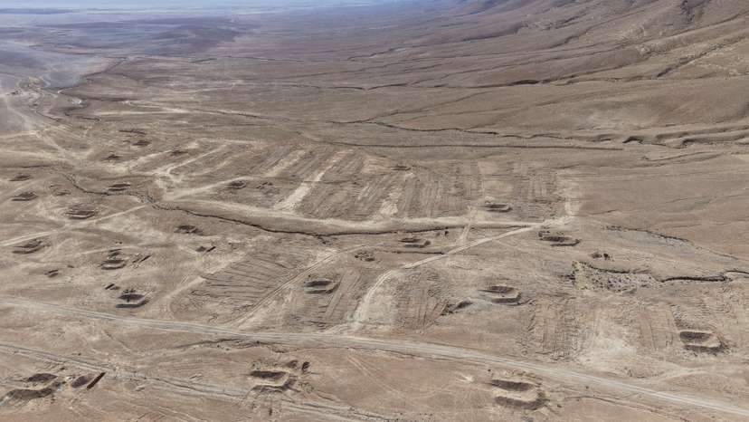 A drone view of the mass grave site in the desert near the eastern Syrian town of Dhumair