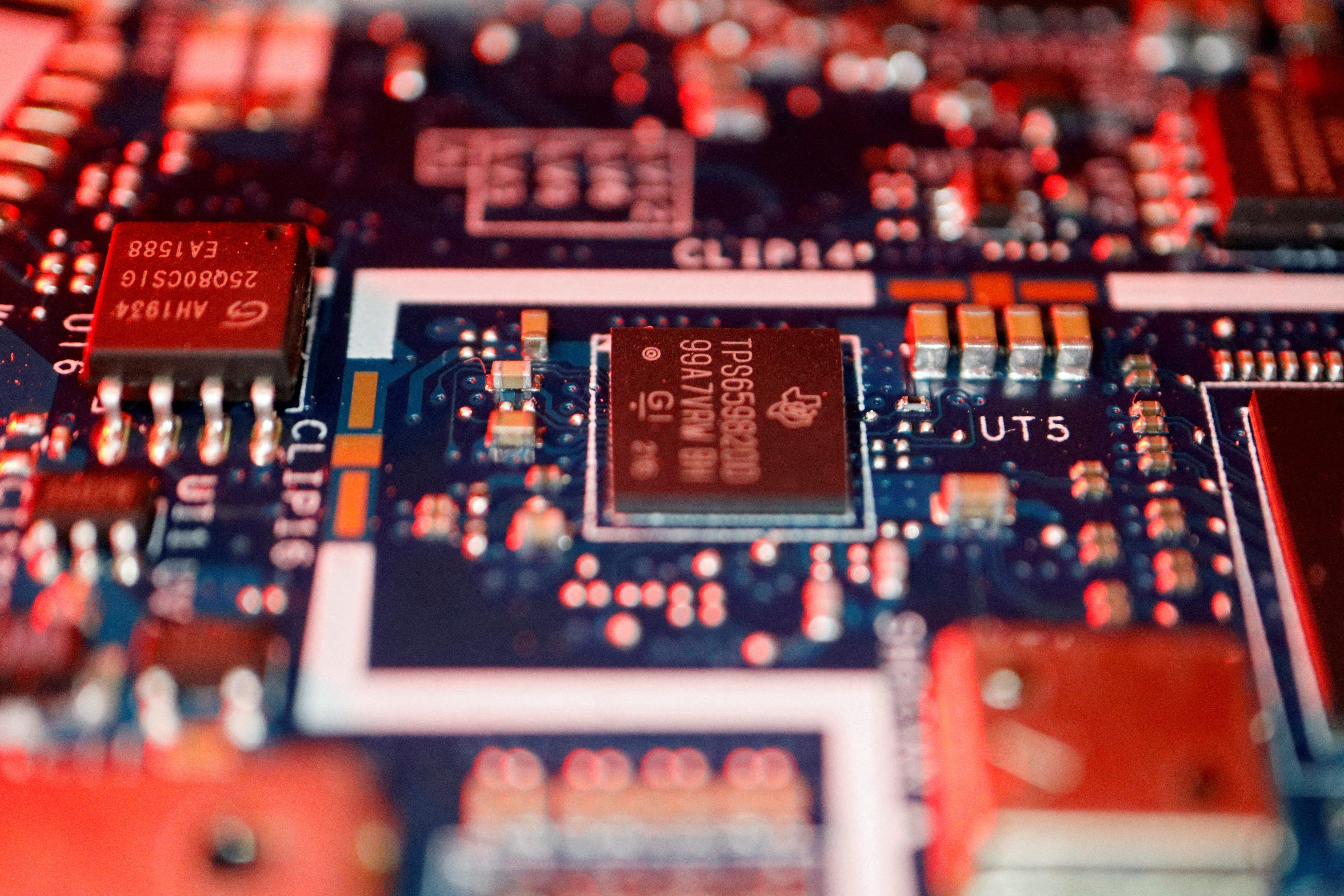 FILE PHOTO: Illustration picture of semiconductor chips on a circuit board