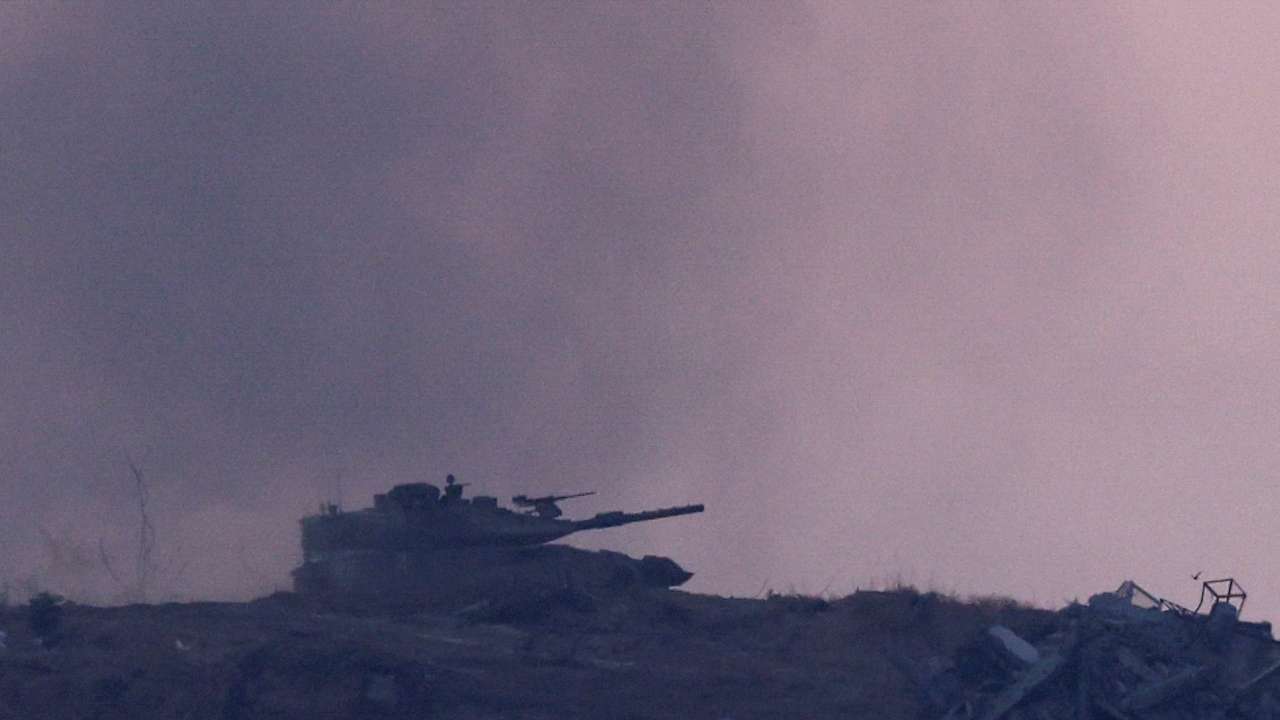 Israeli tanks manoeuvre near the Gaza-Israel border, in Israel