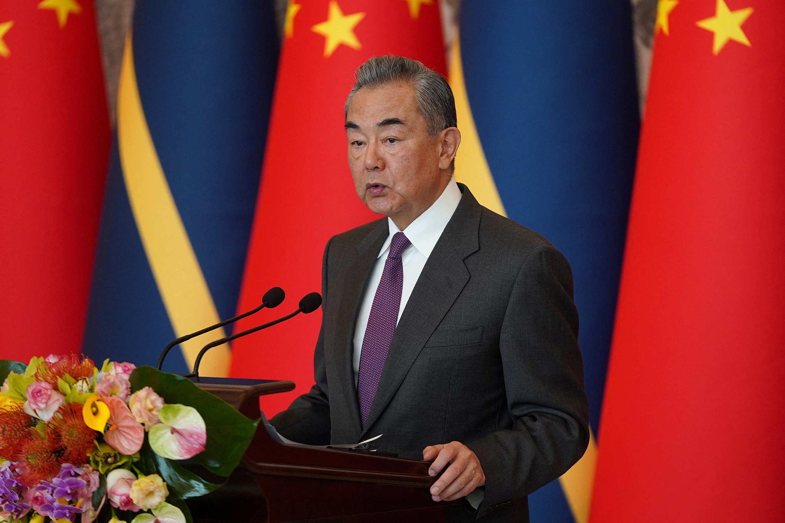 China's Foreign Minister Wang Yi hosts an event at the Diaoyutai State Guesthouse in Beijing