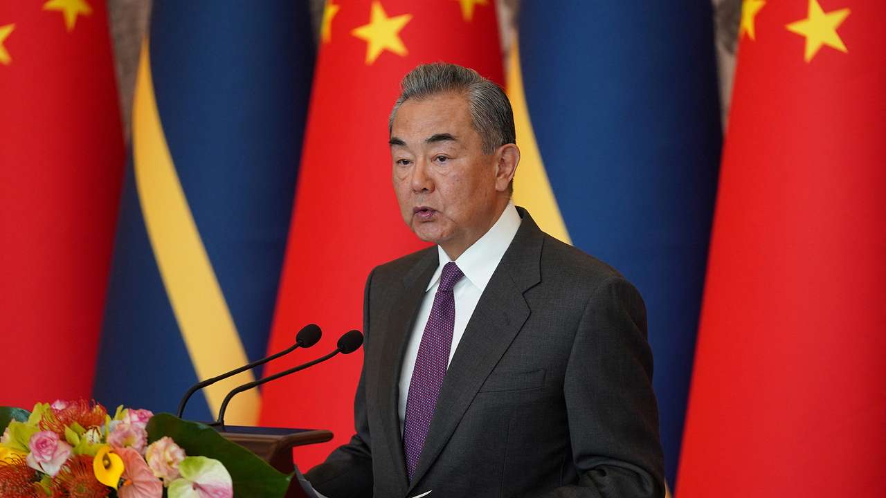 China's Foreign Minister Wang Yi hosts an event at the Diaoyutai State Guesthouse in Beijing