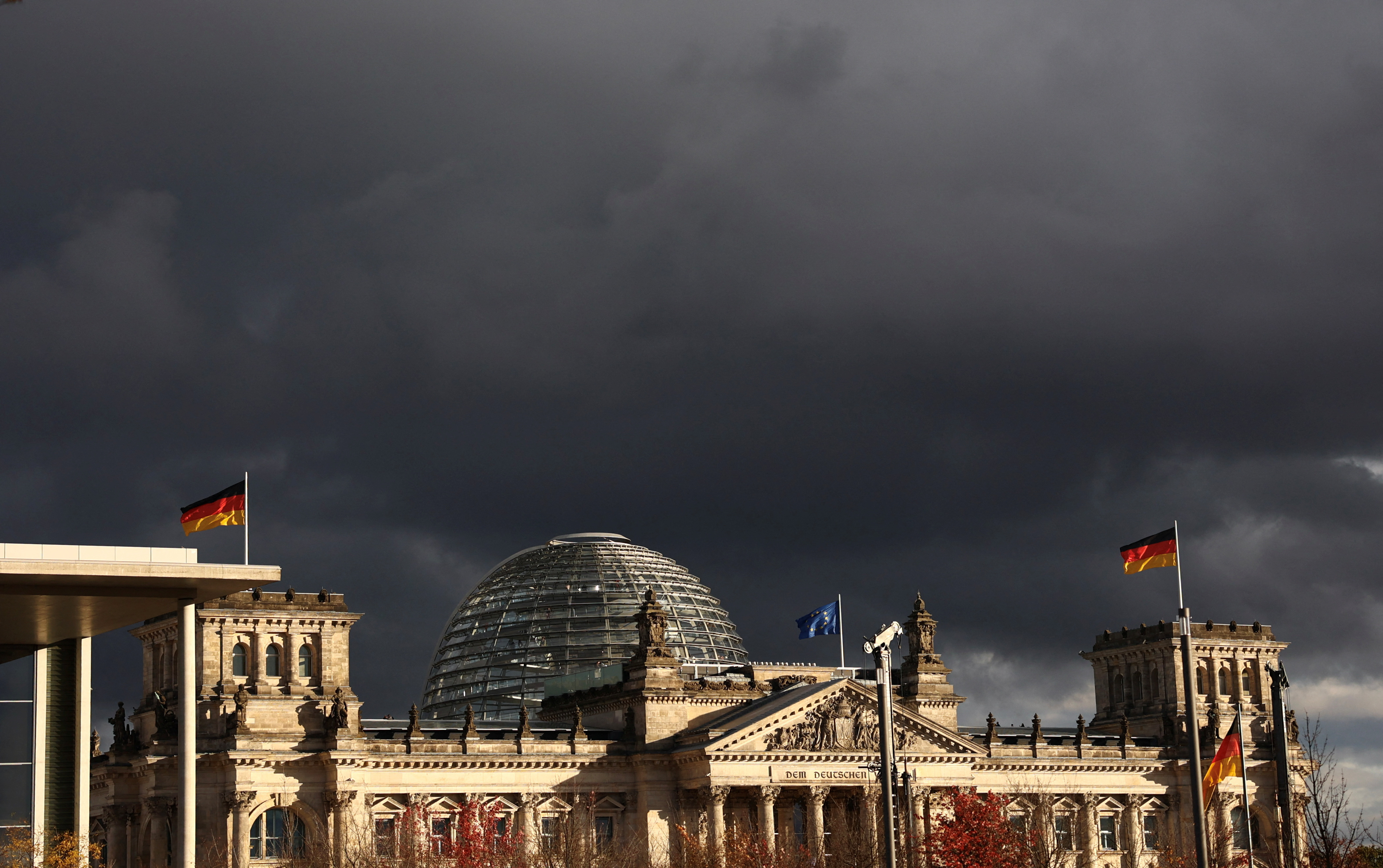FILE PHOTO: Dark clouds over the Bundestag in berlin