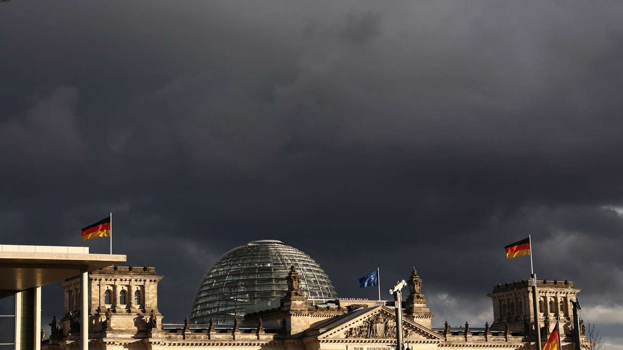FILE PHOTO: Dark clouds over the Bundestag in berlin