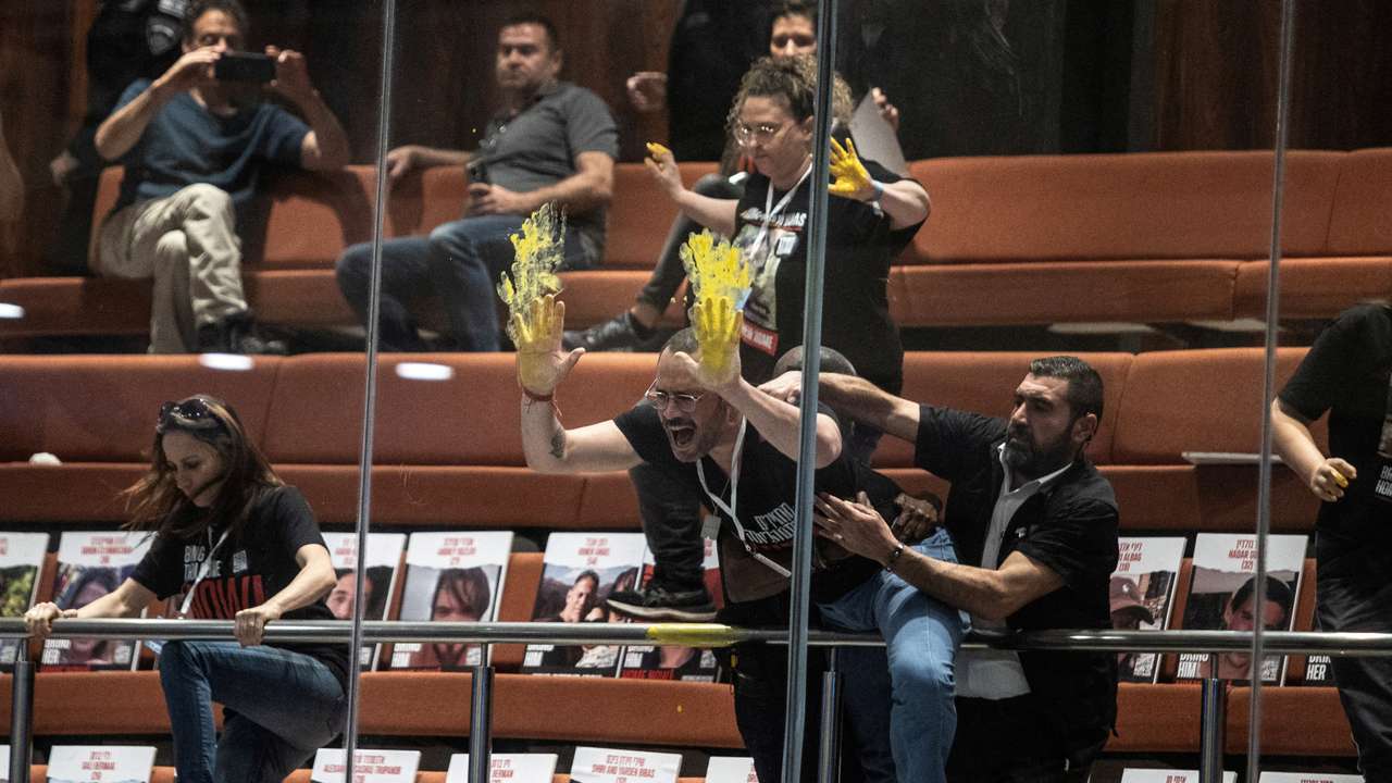 Families and supporters of hostages kidnapped during the deadly October 7 attack on Israel protest inside Israel's parliament in Jerusalem