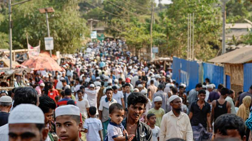 Rohingya refugees gather at roadside kitchen market, at the refugee camp in Cox's Bazar