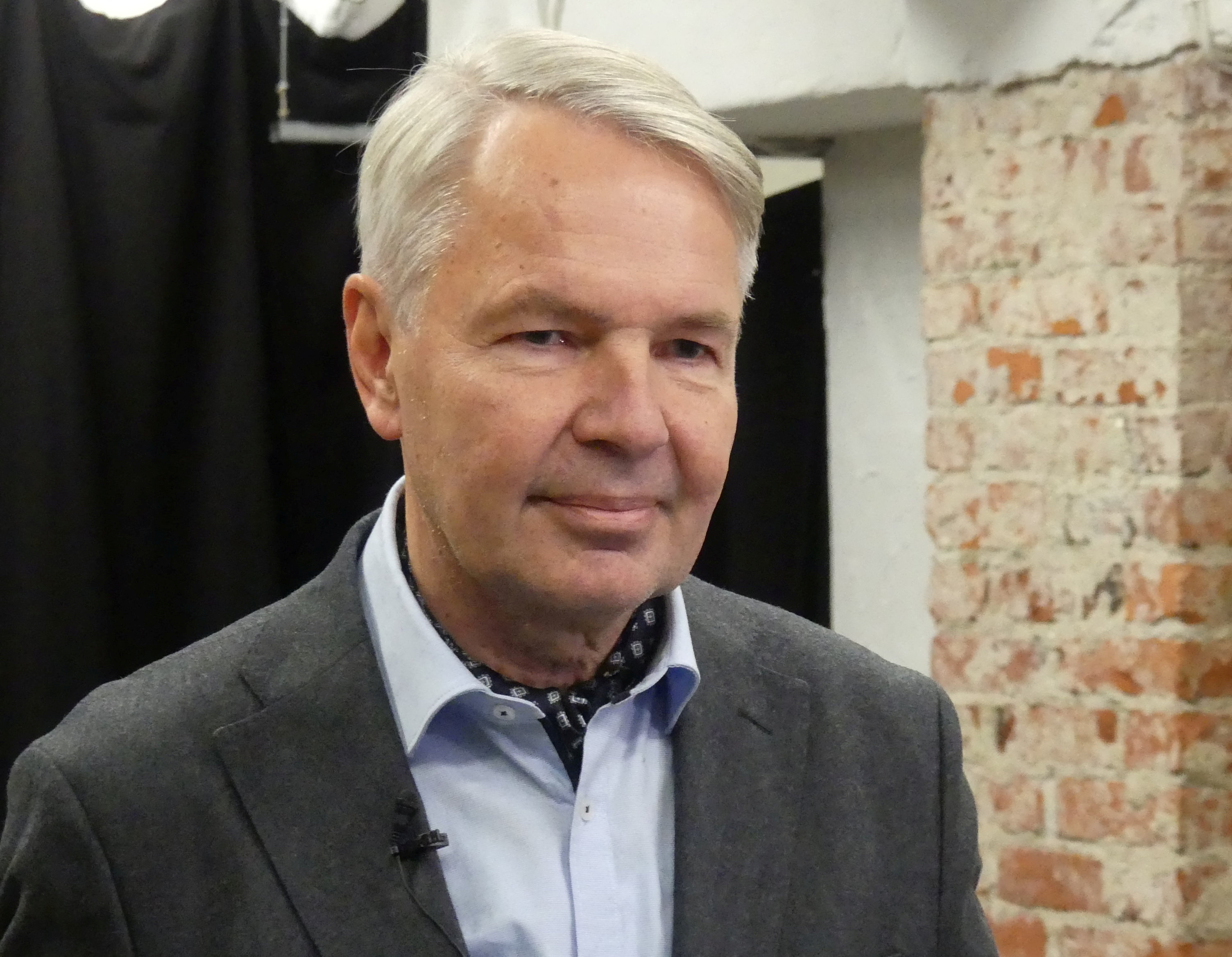 Finnish presidential candidate and former Foreign Minister Pekka Haavisto talks to members of the media before DJ-ing in Helsinki