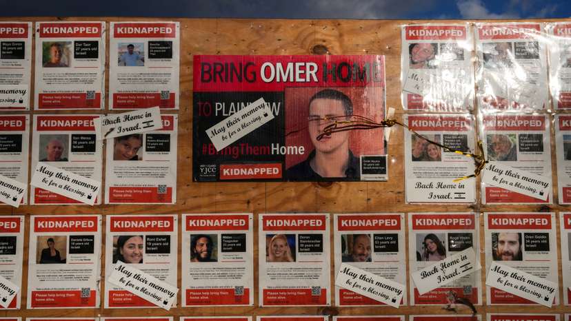 Posters of Israeli hostages are displayed in Plainview, New York, on the day of a memorial service for Omer Neutra, an American member of the Israeli Defense Forces
