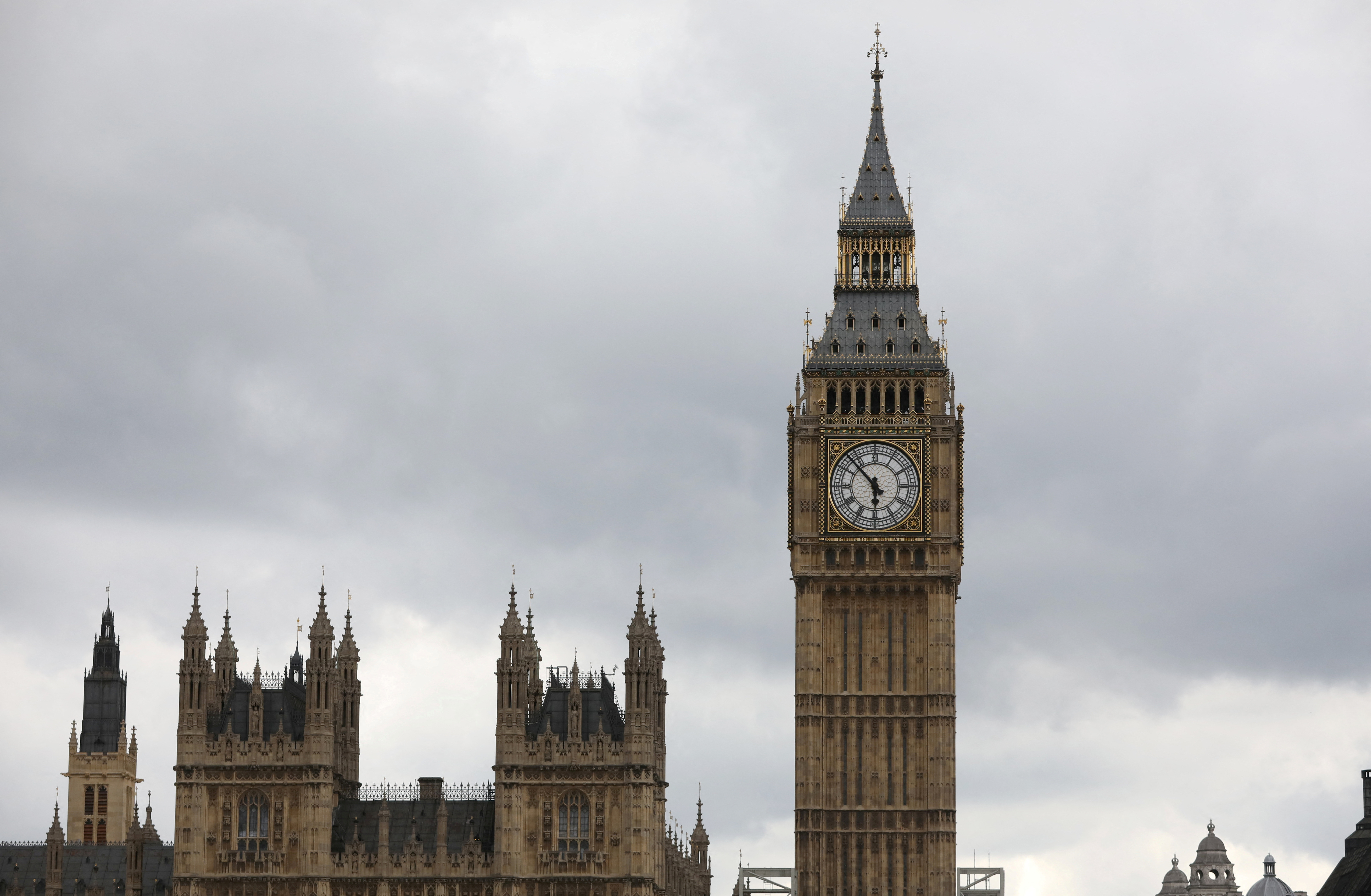 FILE PHOTO: Clouds hang above the Houses of Parliament in central London