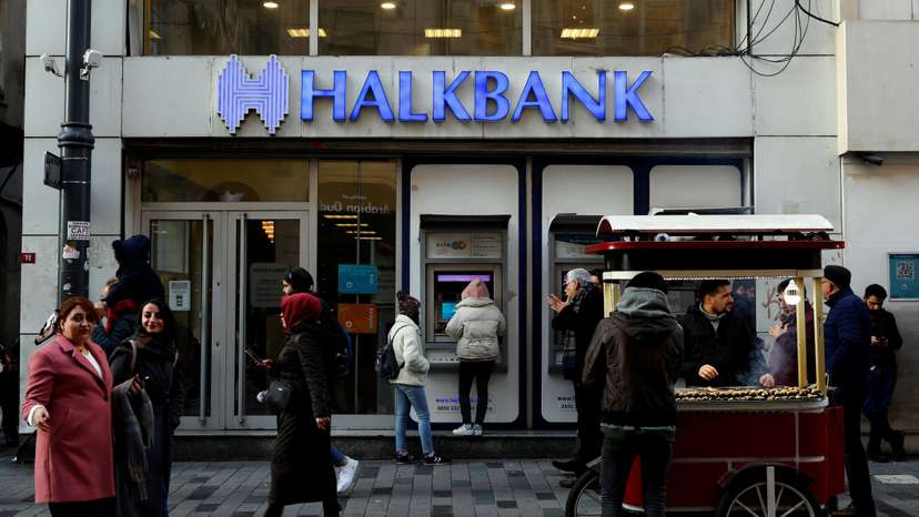 FILE PHOTO: People walk past a branch of Halkbank in central Istanbul