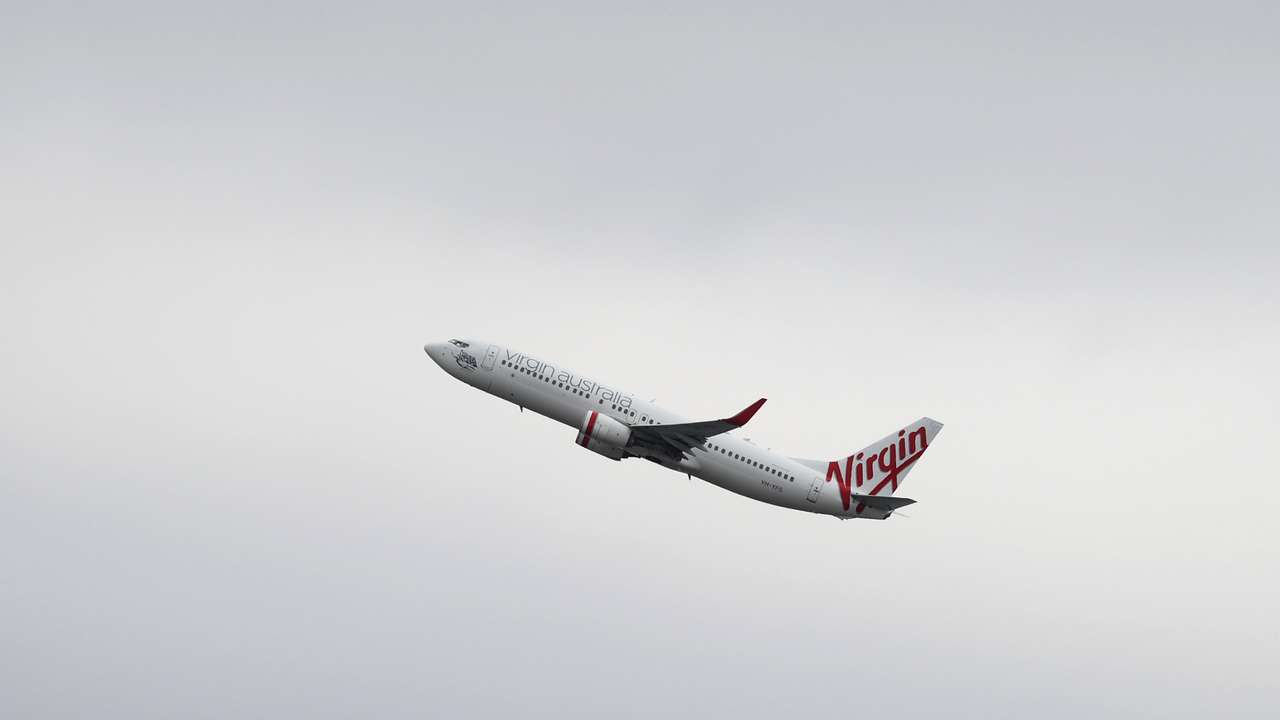 A Virgin Australia Airlines plane takes off from Sydney Airport in Sydney