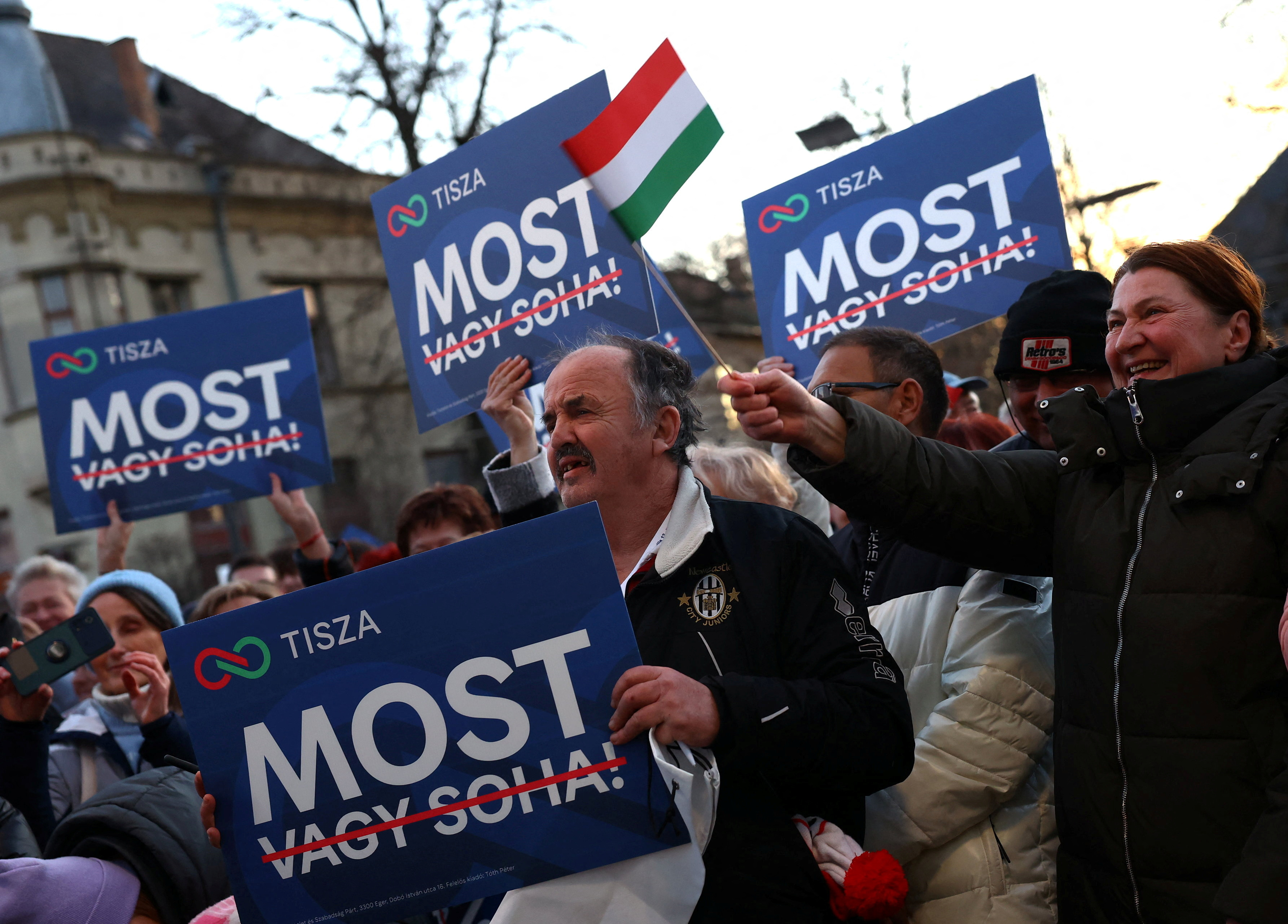 People listen to the speech of Magyar, leader of the opposition Tisza party, during his election campaign tour in Balassagyarmat