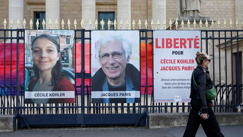 FILE PHOTO: Posters of Cecile Kohler and Jacques Paris in front of the National Assembly in Paris