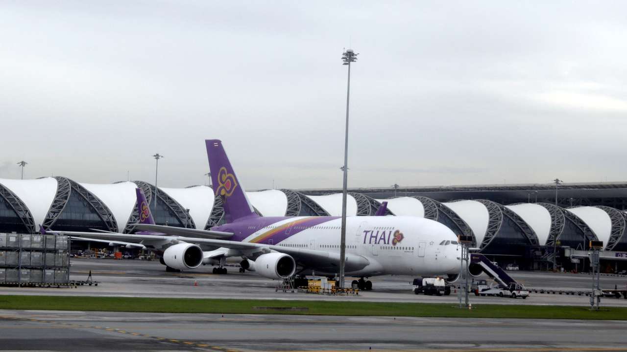 FILE PHOTO: Workers service a Thai Airways aircraft at Bangkok International Suvarnabhumi Airport