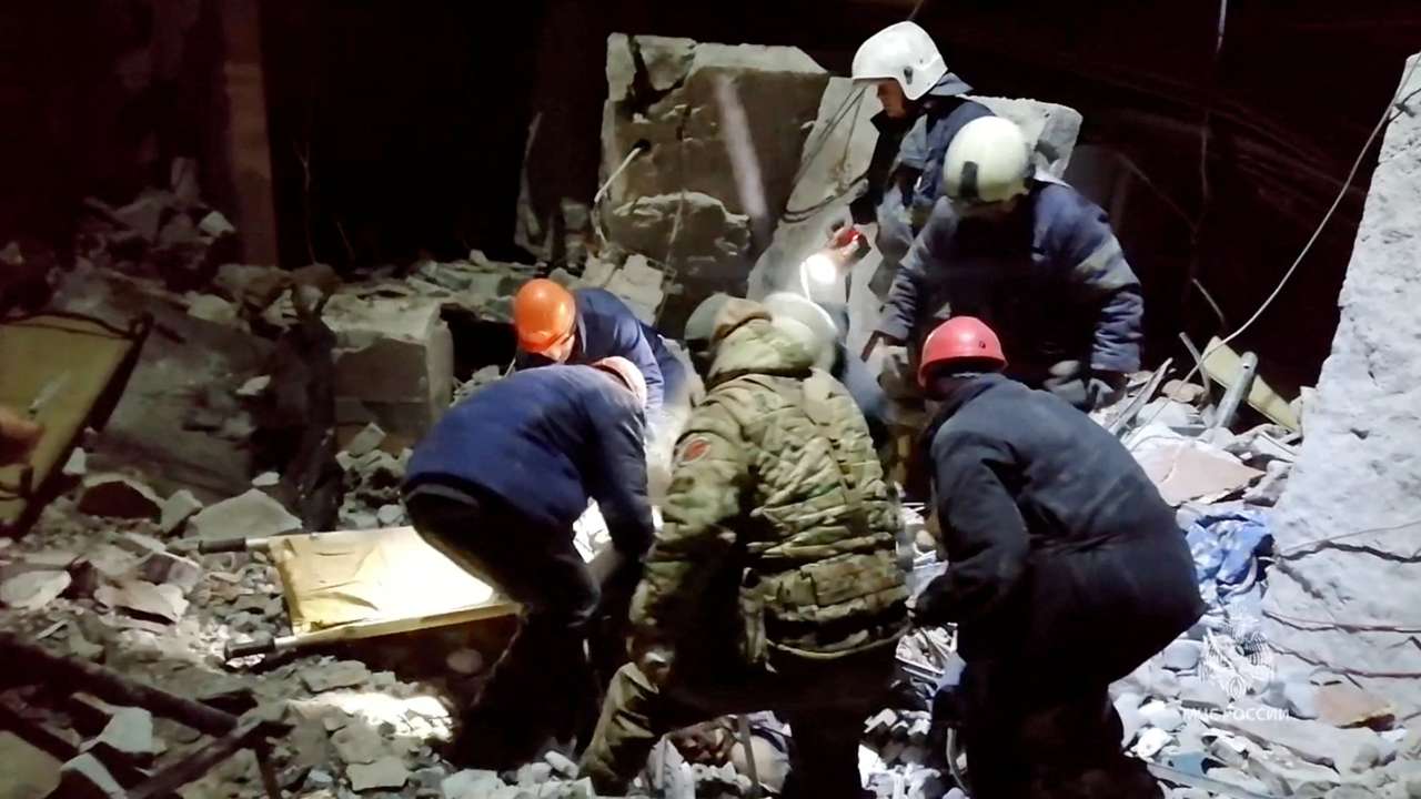 Emergency responders retrieve bodies from the rubble of a devastated building following a Ukrainian attack on the city of Lysychansk