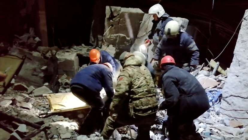 Emergency responders retrieve bodies from the rubble of a devastated building following a Ukrainian attack on the city of Lysychansk