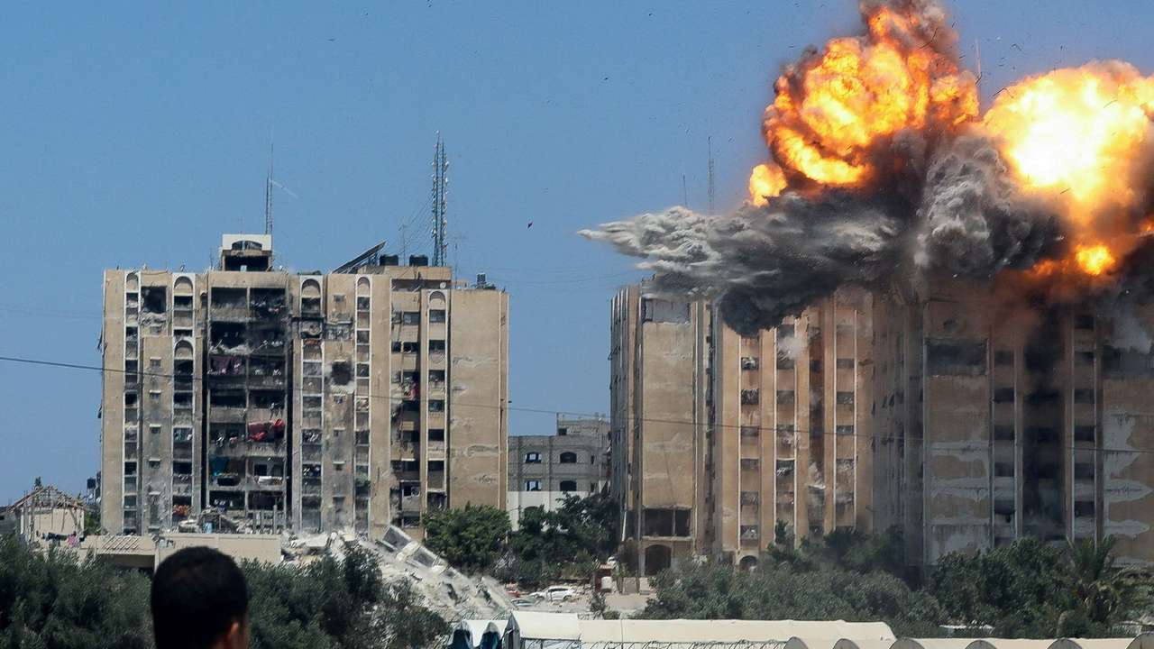 Explosion following an Israeli air strike on a residential building, amid the Israel-Hamas conflict, in Nuseirat