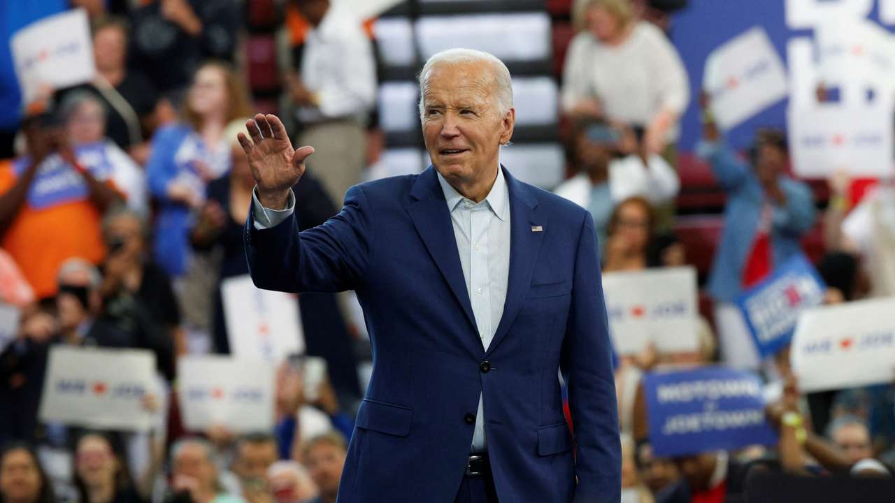 U.S. President Joe Biden waves to his supporters during a campaign stop in Detroit