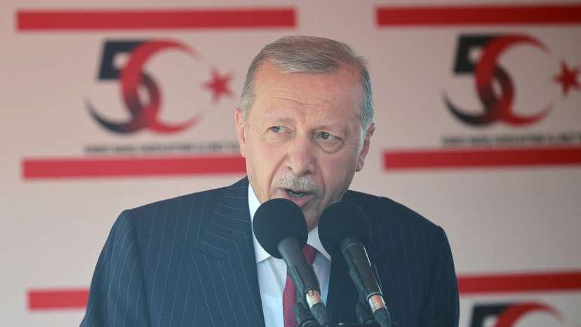 Turkish President Tayyip Erdogan attends a military parade to mark the 1974 Turkish invasion of Cyprus in response to a short-lived Greek-inspired coup, in the Turkish-controlled northern Cyprus, in the divided city of Nicosia