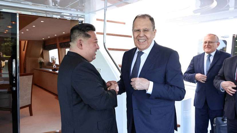 North Korean leader Kim Jong Un shakes hands with Russian Foreign Minister Sergei Lavrov during a meeting in Wonsan