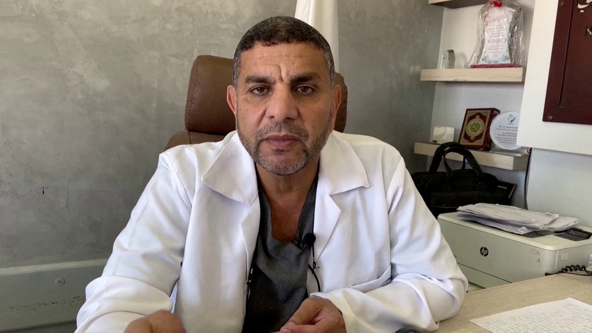 Marwan Al-Hams, a senior Gaza Health Ministry offical, speaks at his office