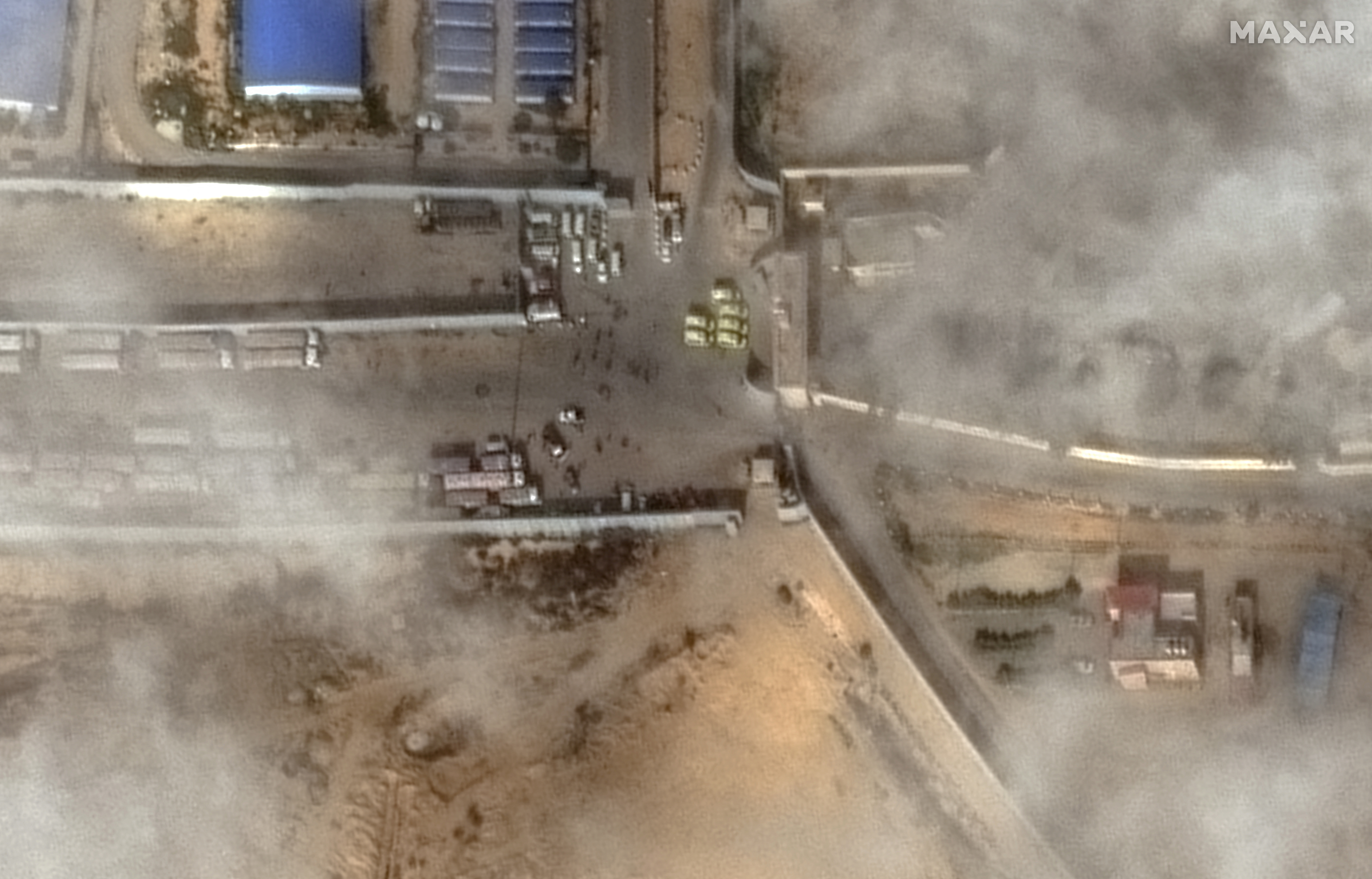 A satellite image shows a closer view of aid trucks waiting at the Rafah-Egypt border