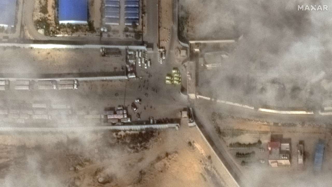 A satellite image shows a closer view of aid trucks waiting at the Rafah-Egypt border
