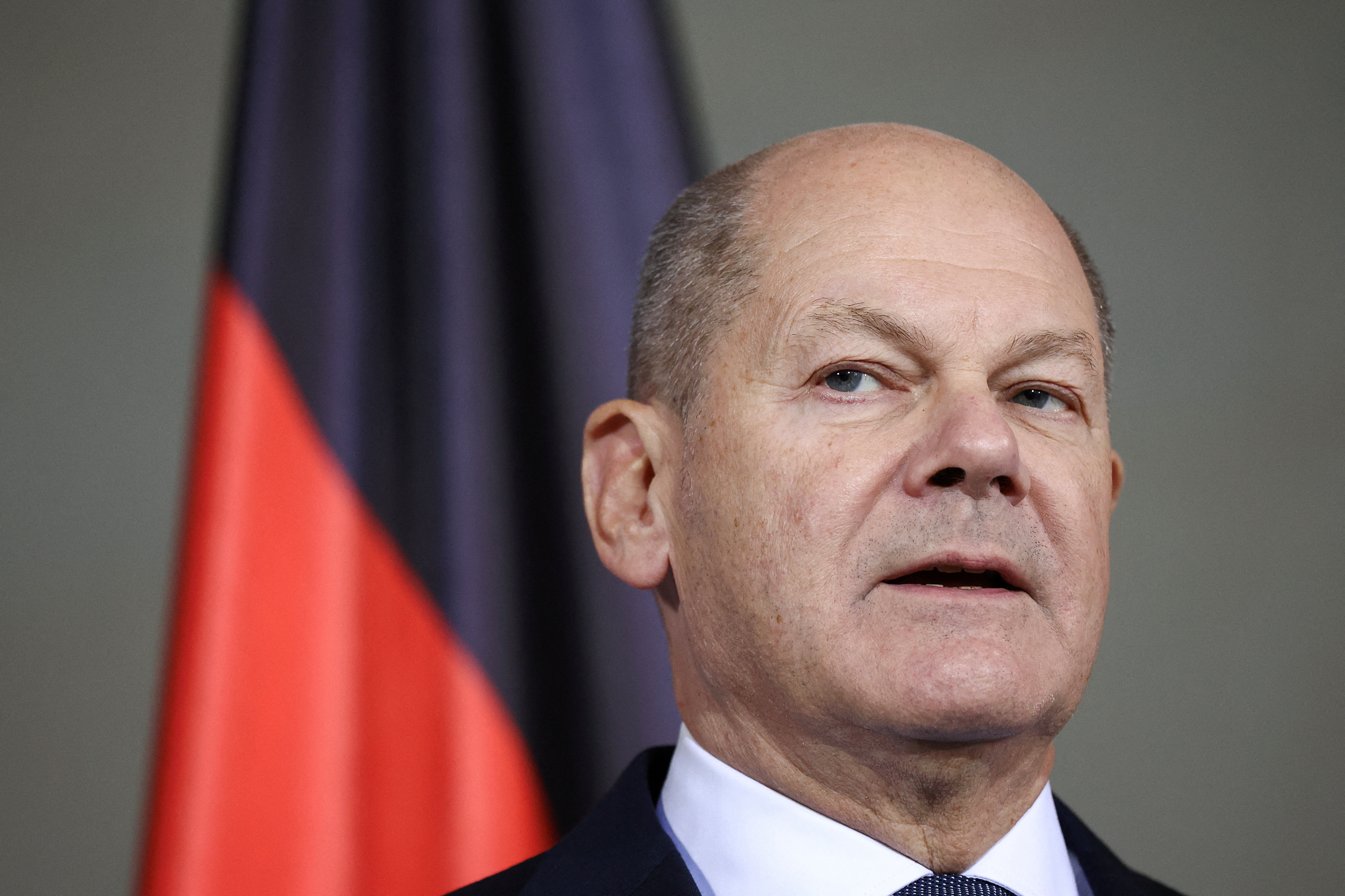FILE PHOTO: German Chancellor Scholz talks to reporters after confidence vote request submitted in Berlin