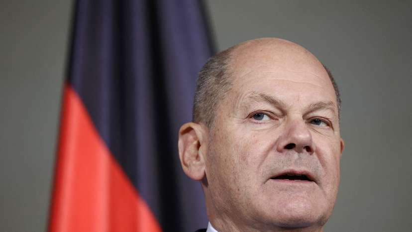 FILE PHOTO: German Chancellor Scholz talks to reporters after confidence vote request submitted in Berlin