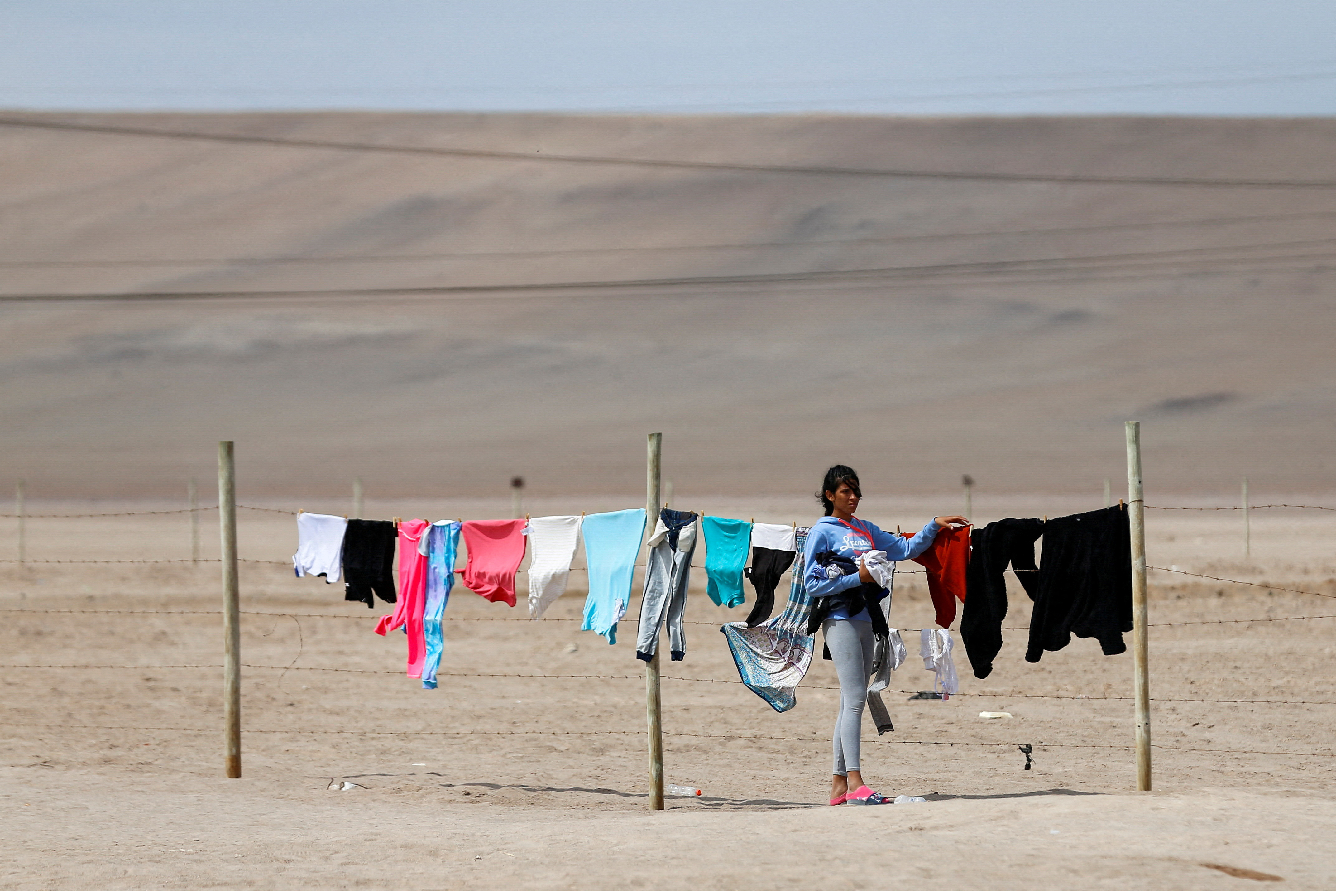 FILE PHOTO: Undocumented migrants remain stuck in Chile after Peru refused to open its borders to migrants, in Chacalluta area, Arica