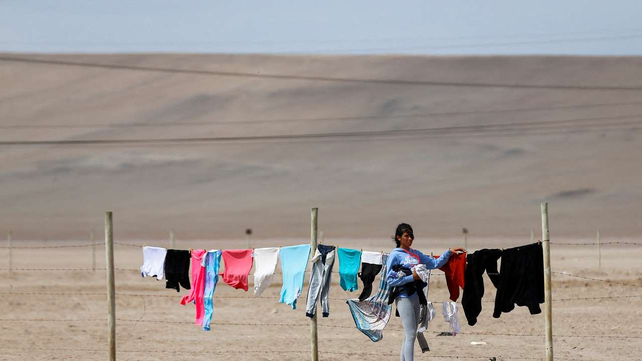 FILE PHOTO: Undocumented migrants remain stuck in Chile after Peru refused to open its borders to migrants, in Chacalluta area, Arica