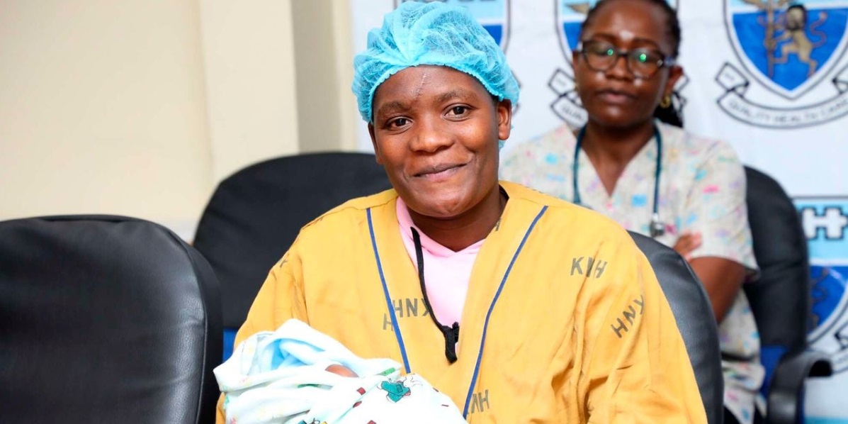 Melodius Moraa cuddles her baby during the interview at the Kenyatta National Hospital 1
