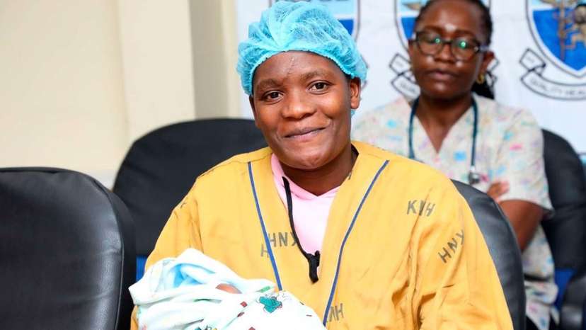 Melodius Moraa cuddles her baby during the interview at the Kenyatta National Hospital 1