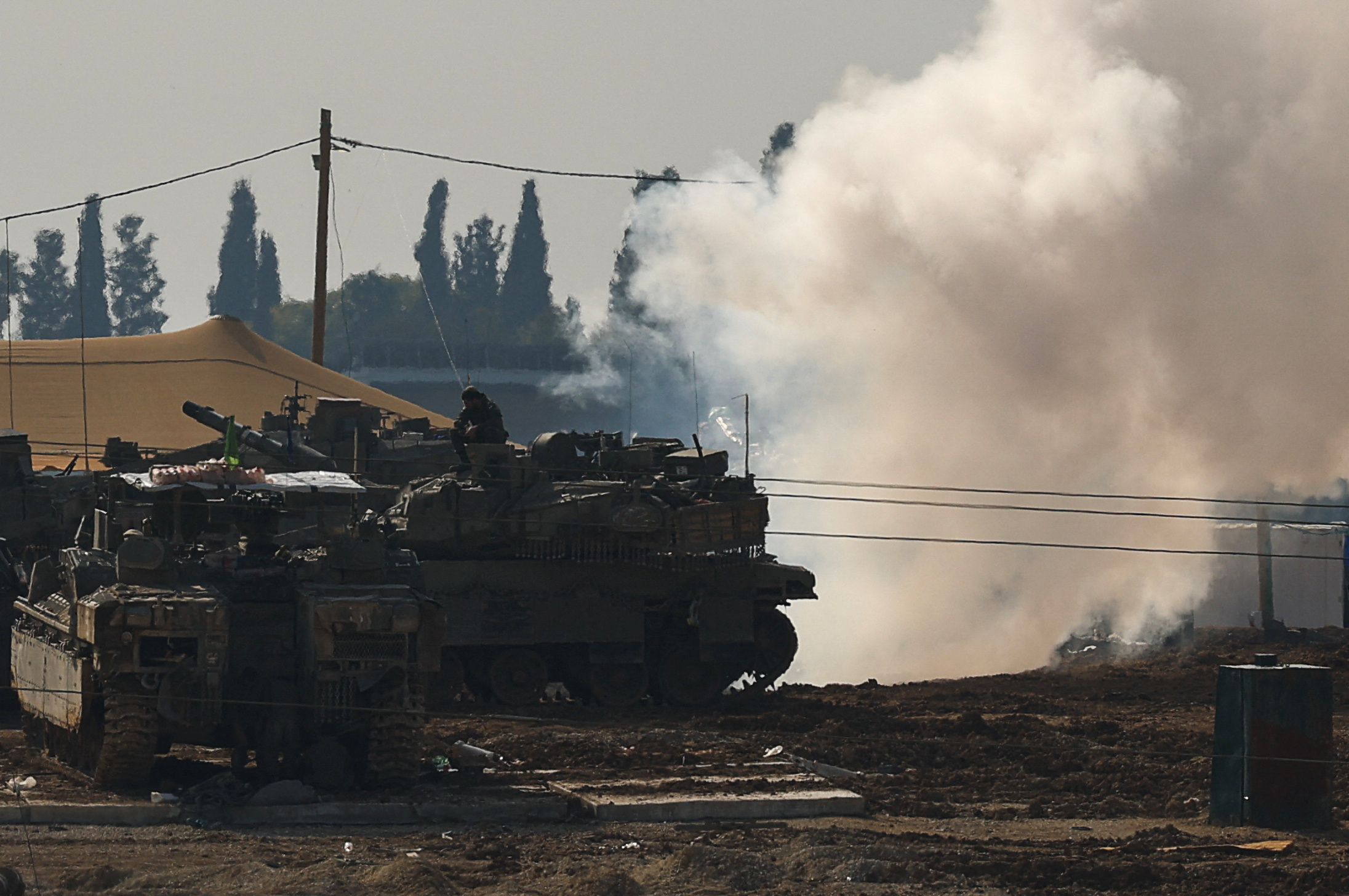 Israeli military vehicles operate, near the Israel-Gaza border, in Israel