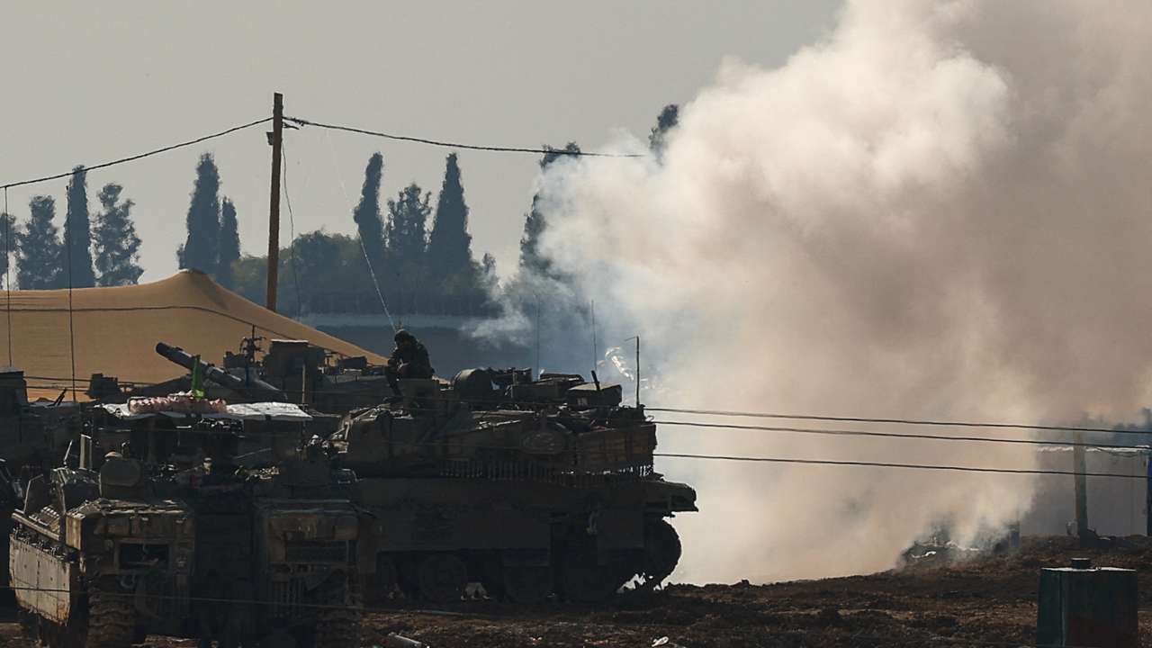 Israeli military vehicles operate, near the Israel-Gaza border, in Israel