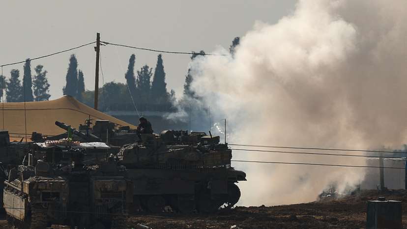 Israeli military vehicles operate, near the Israel-Gaza border, in Israel