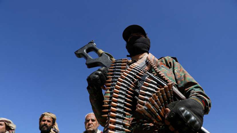 FILE PHOTO: Houthi policeman takes part in a protest against recent U.S.-led strikes on Houthi targets, near Sanaa