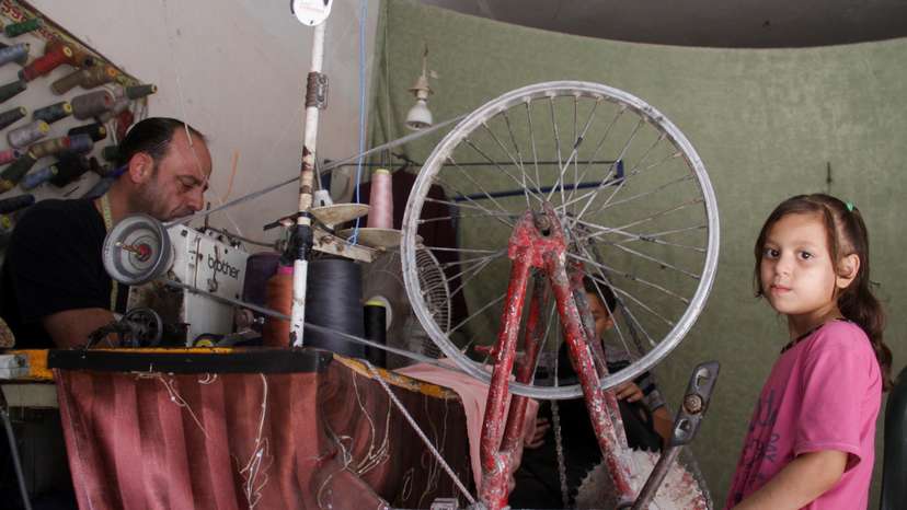 Gazan tailor turns to bicycle to power sewing machine